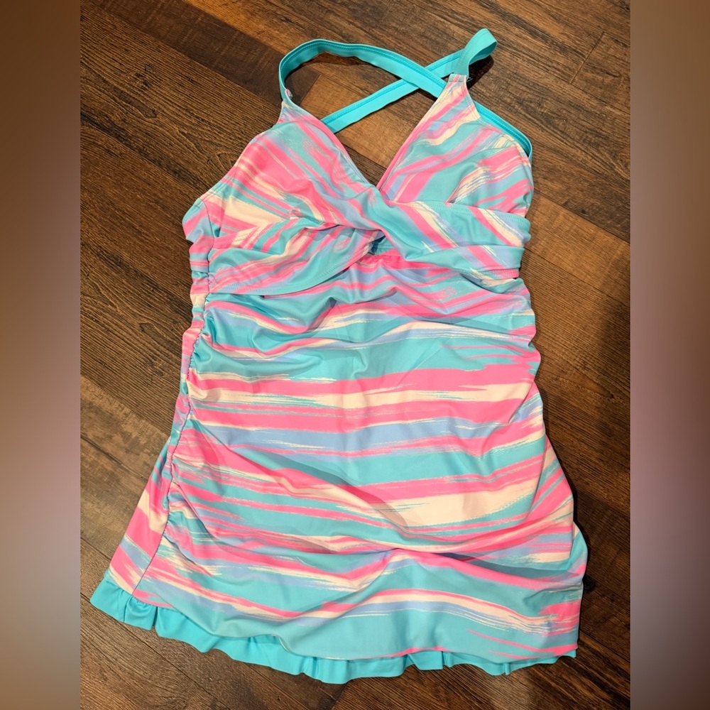 Vibrant Striped skirted swimsuit with ruffles along the bottom.